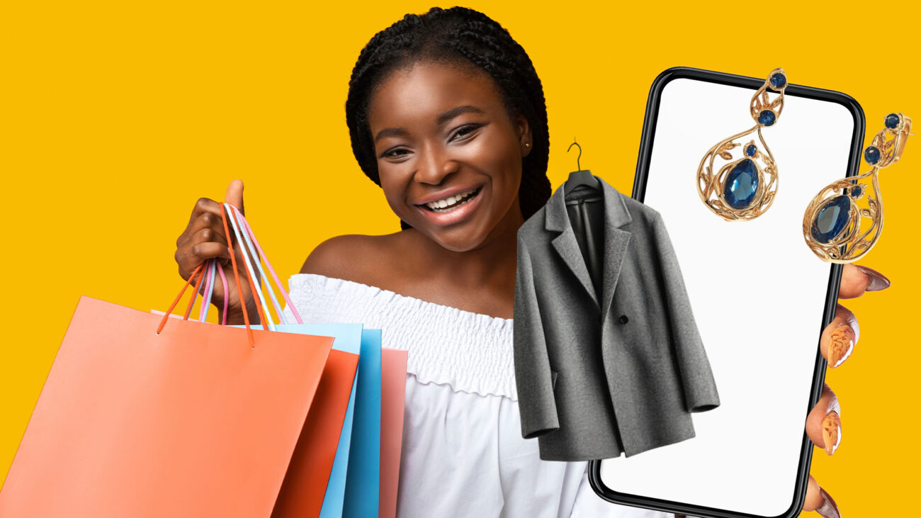 A woman holds shopping bags and a phone displaying a shopping app, ready to explore diverse products from Black-owned businesses.
