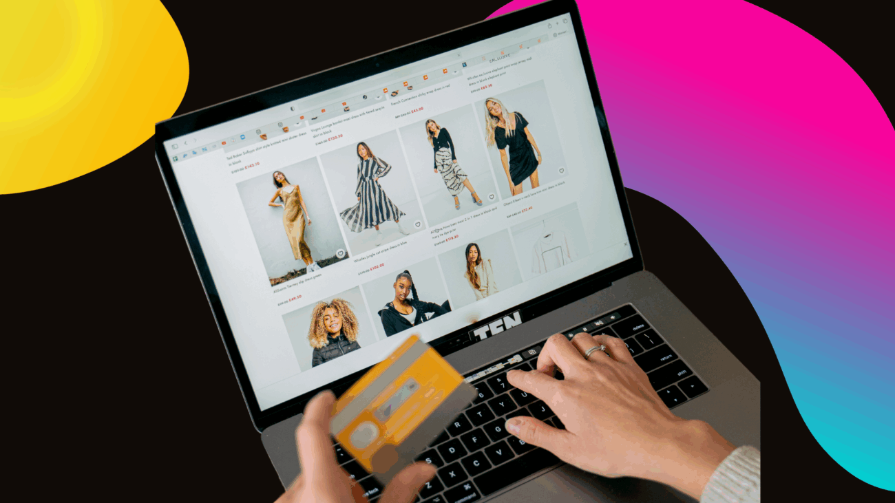A person uses a laptop with a credit card, symbolizing online shopping at a multi-vendor black-owned marketplace.
